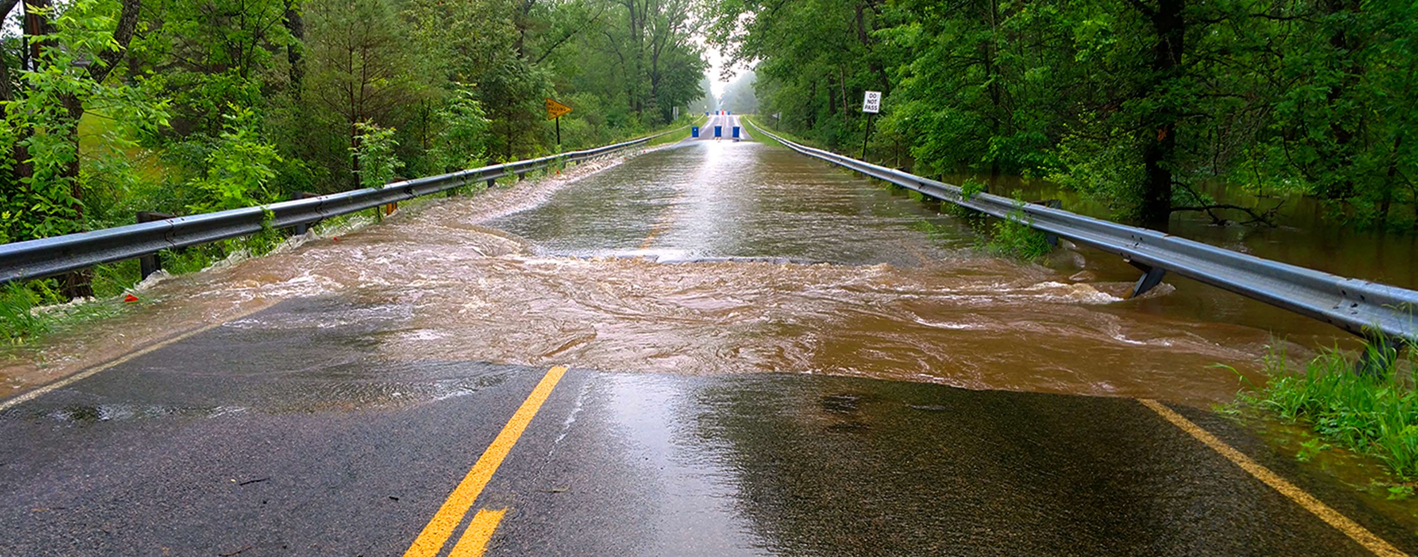 Rainfall and high water flooded and damaged Midland County roads.