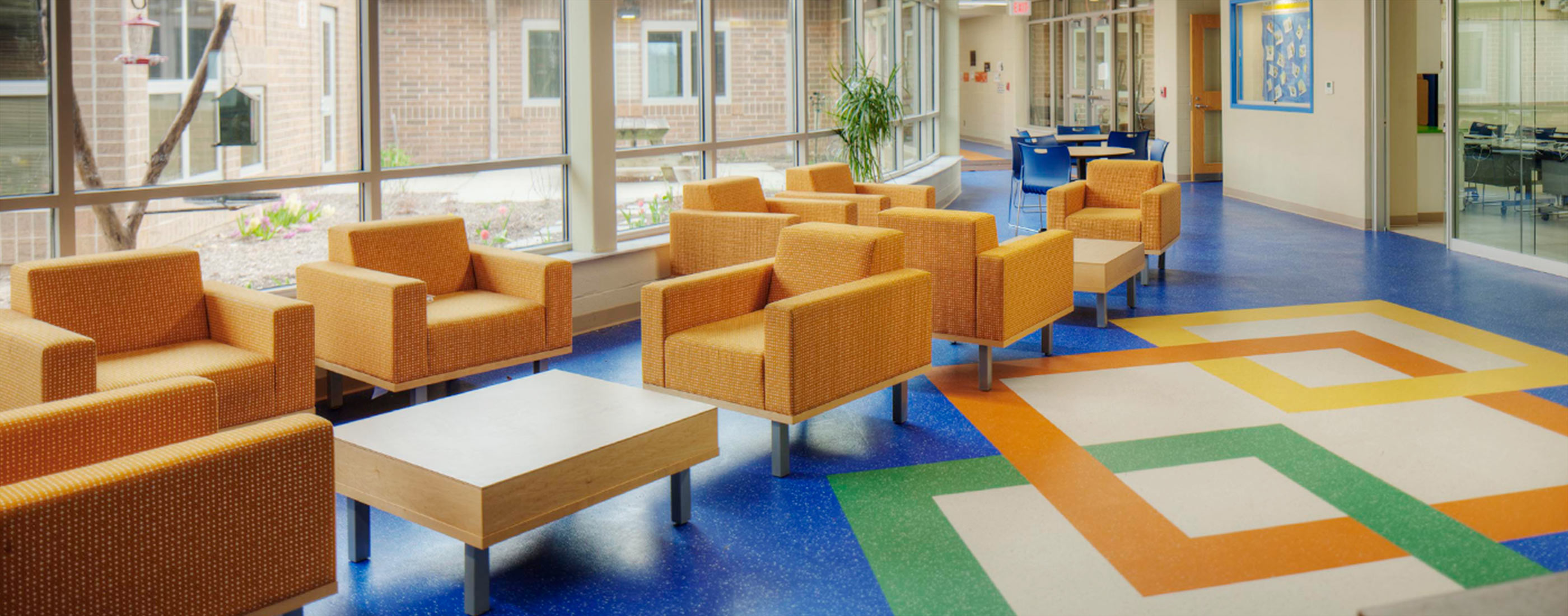 Shared learning spaces and bright colors create a flexible learning environment in West Liberty-Salem Local School District’s campus, designed by OHM Advisors.