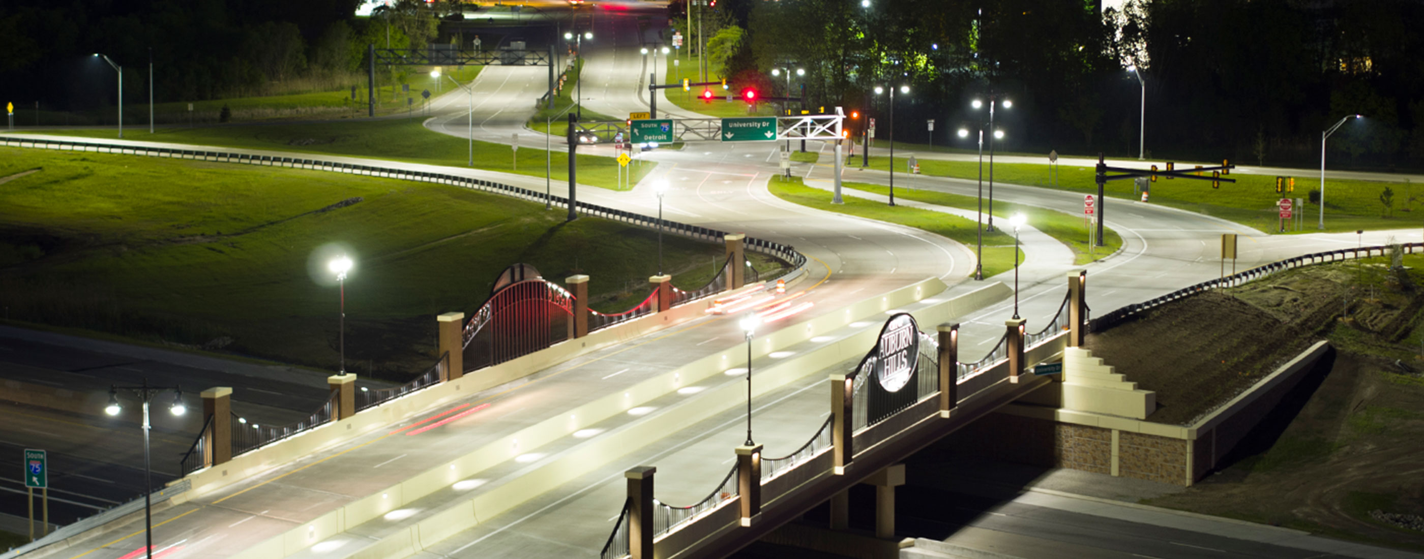 Bright lighting allows pedestrians to cross the bridge in Auburn Hills over I-75 safely.