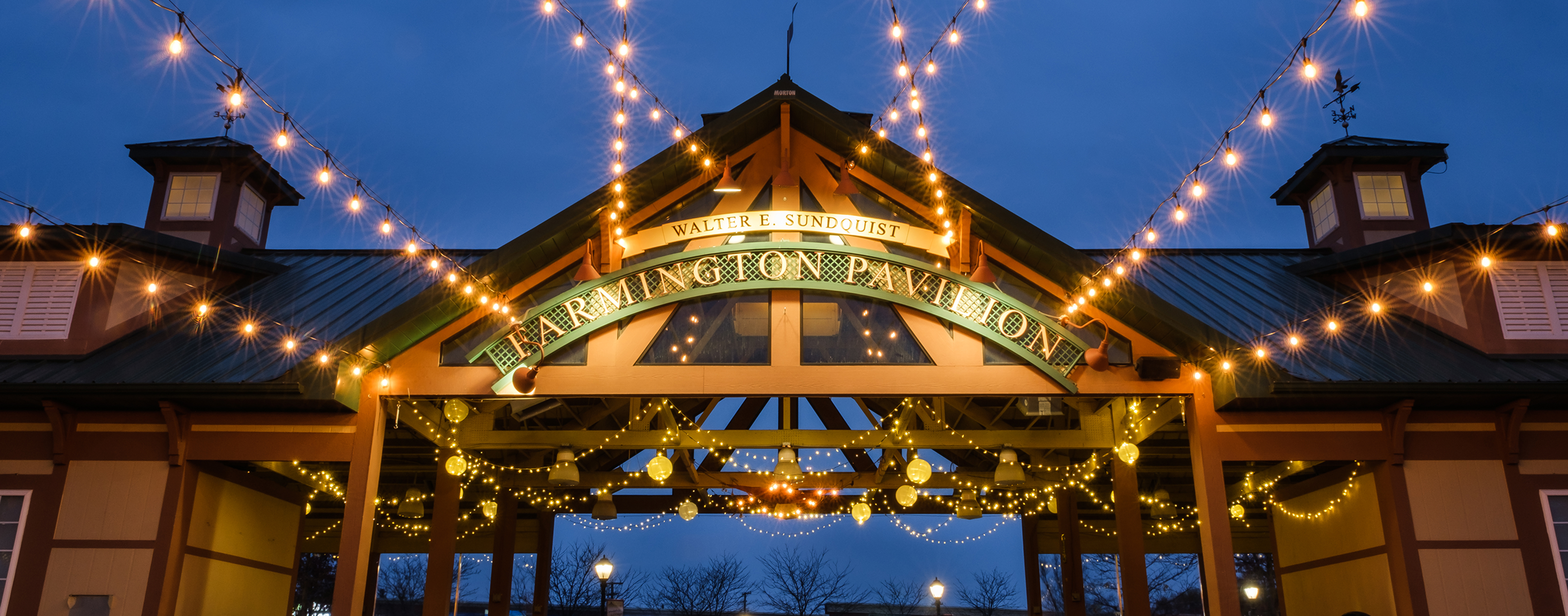 Downtown Farmington's Pavilion lit up at night.