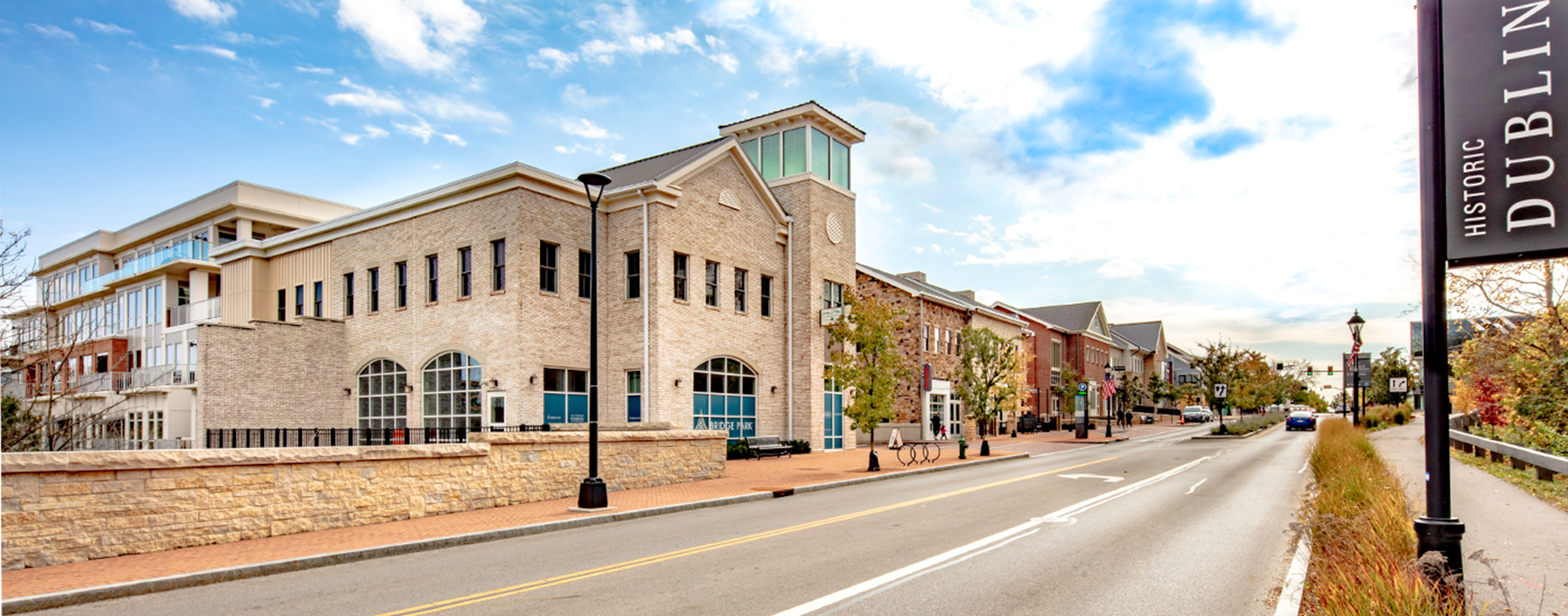 A daytime view of the streetscape along Dublin, Ohio's Bridge Park West mixed-use buildings.