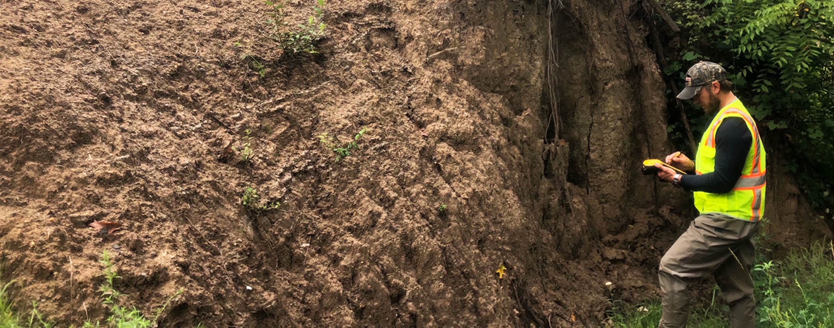 One of our water experts conducts a condition assessment on a trench.