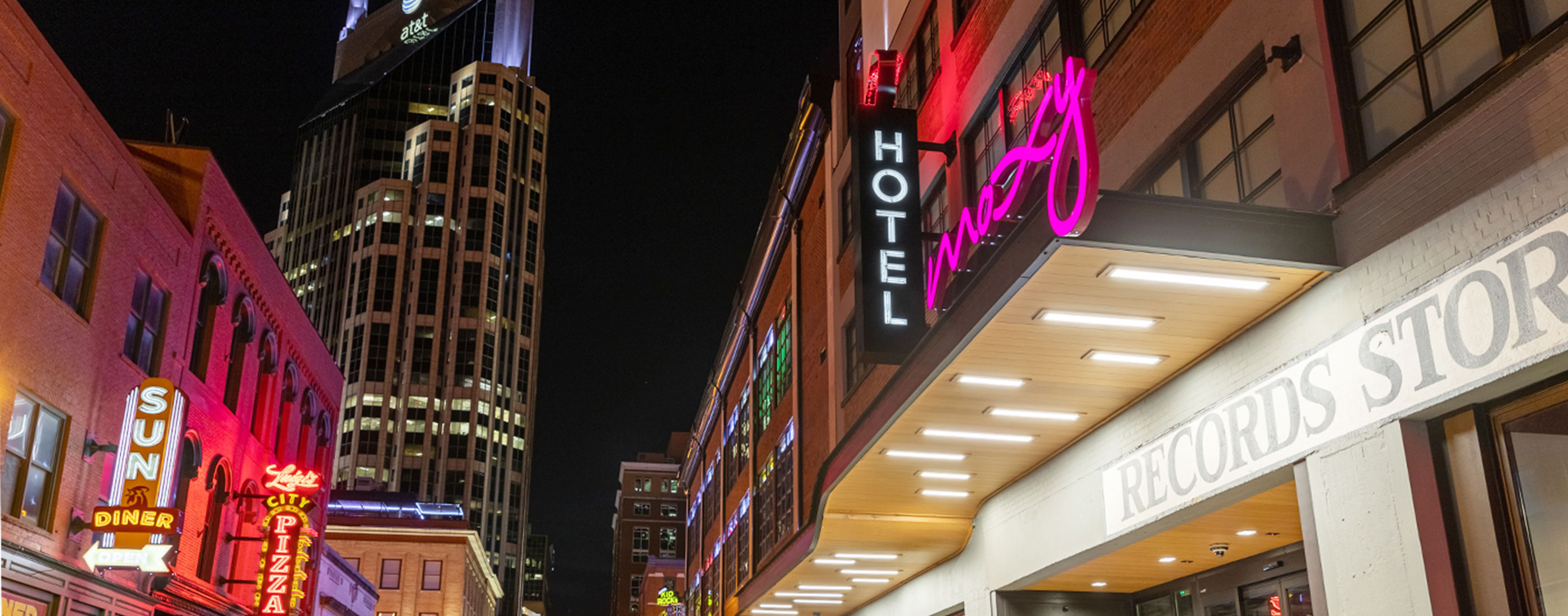 Exterior front shot of the Moxy Hotel at night