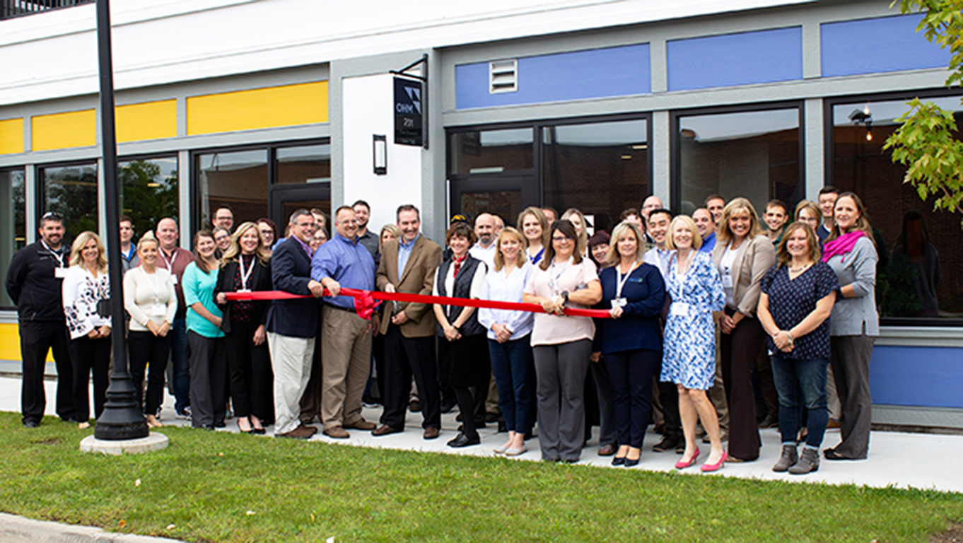 Employees at the opening of the firm's Midland, Michigan office.