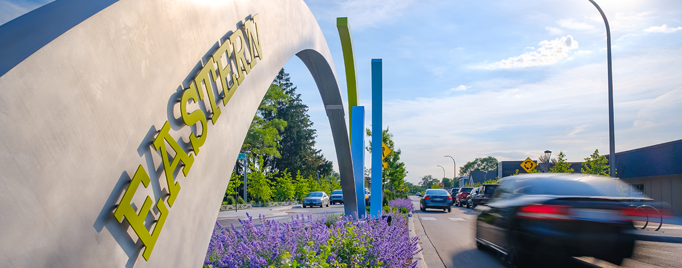 Artwork and landscape within the median along Auburn Rd