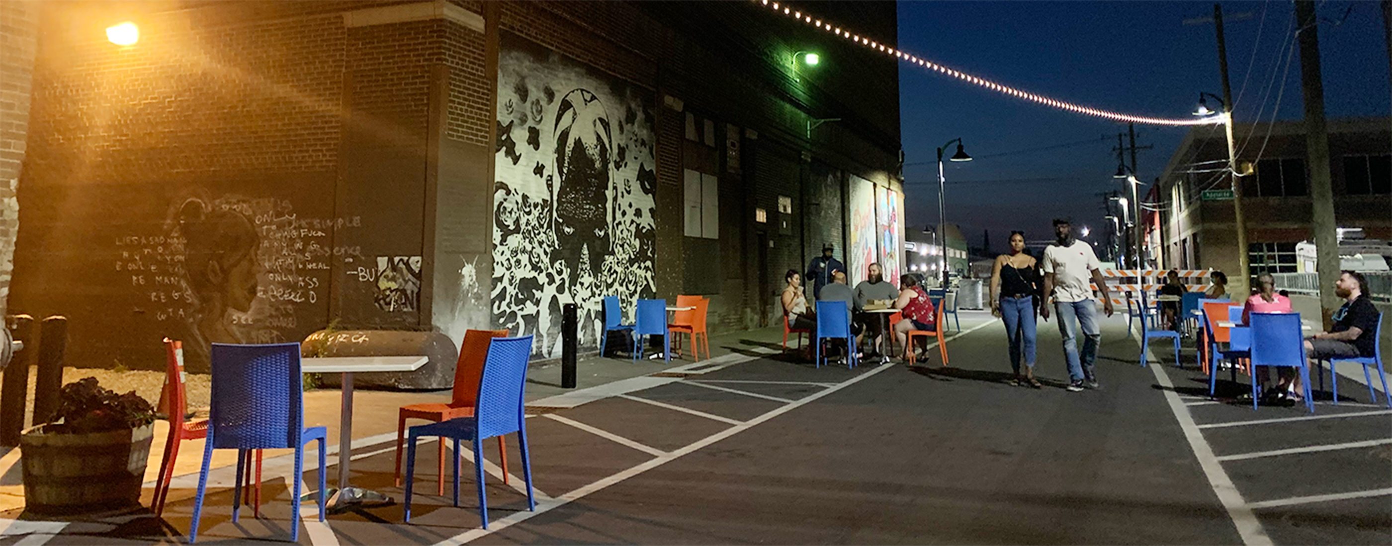 The two southernmost blocks were designed as a one-way “flex” street with flush curbs and sidewalk to allow the street to transform into a pedestrian plaza during social events held by the Eastern Market and local businesses as shown here