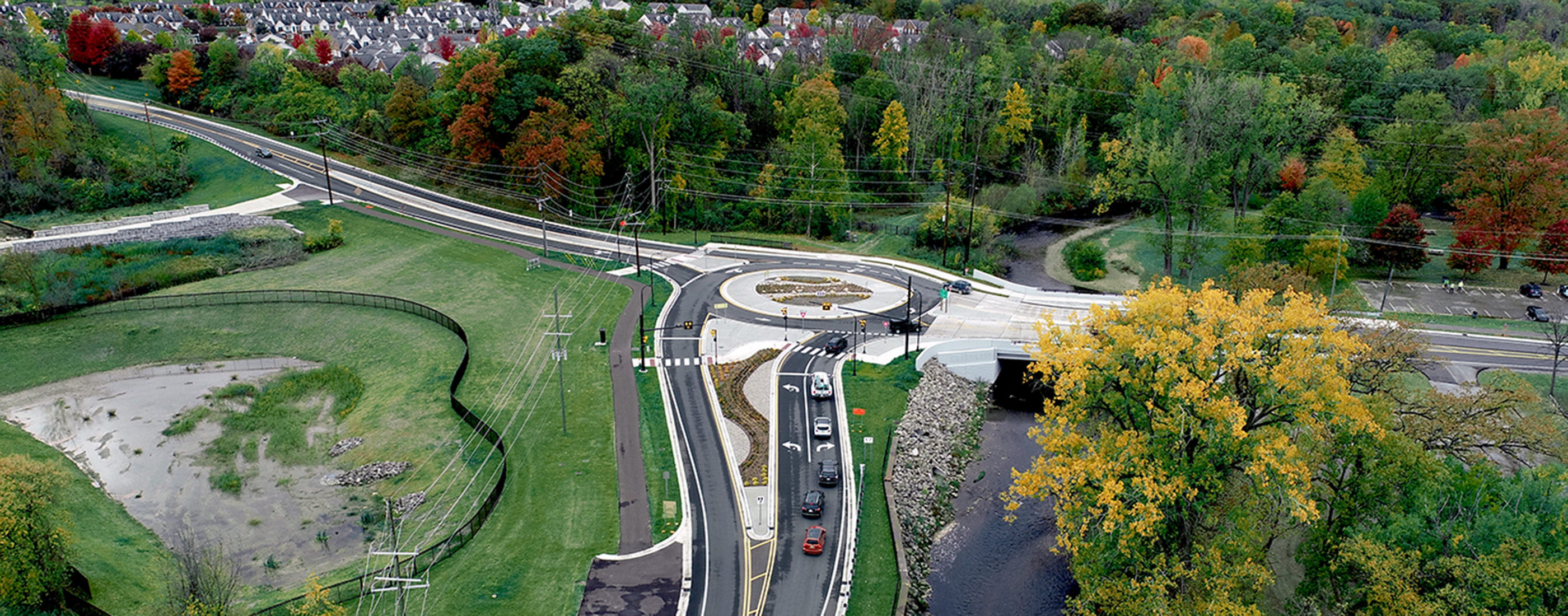 Aerial photo shows of finished roundabout and innovative stormwater management solution.