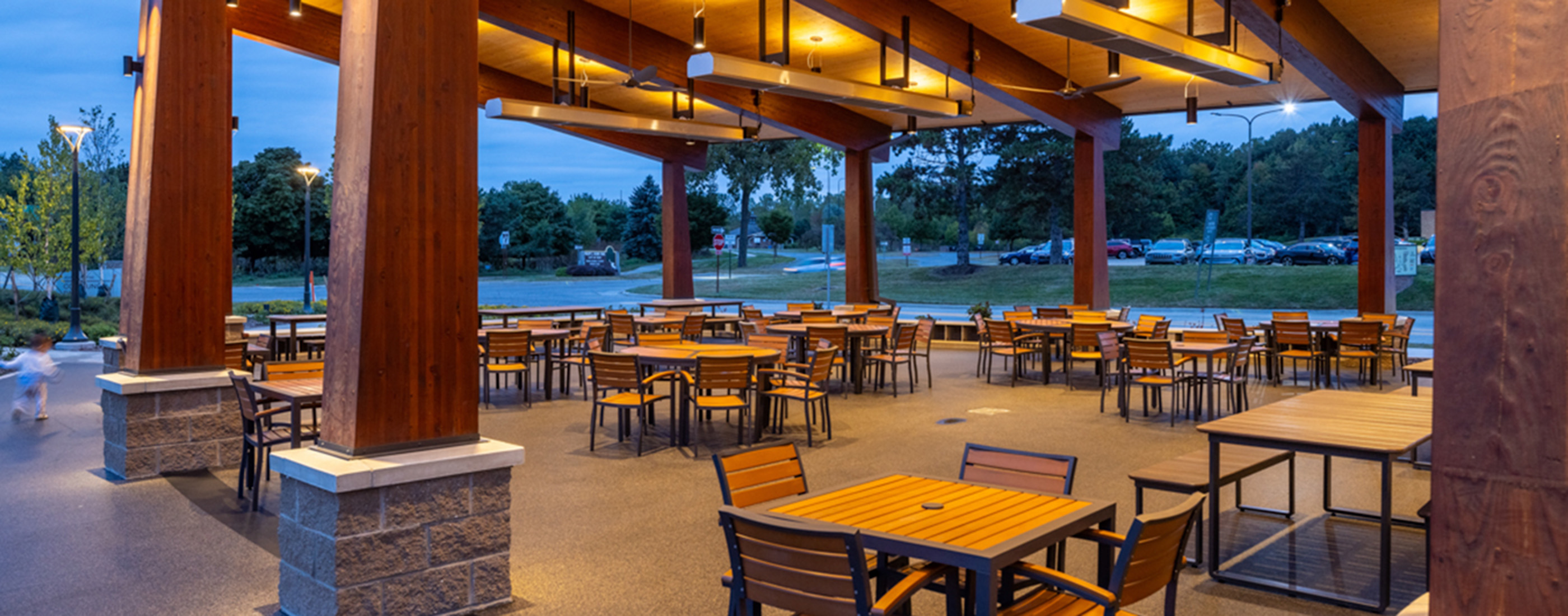 Moveable seating under covered pavilion at Jeanne Stine Park in Troy, Michigan.