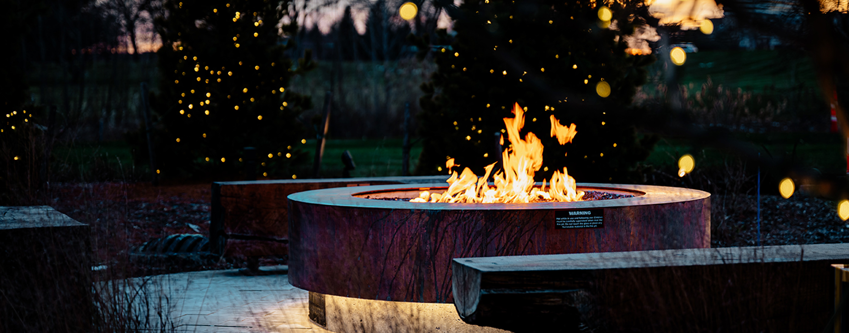Fire pit seating at Jeanne Stine Park in Troy, Michigan.