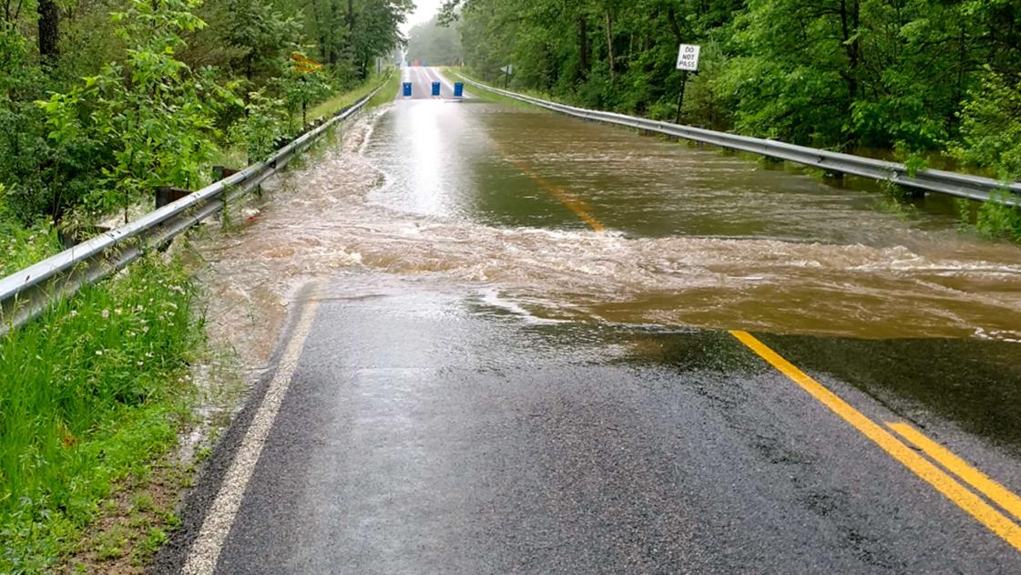 Rainfall and high water flooded and damaged Midland County roads.