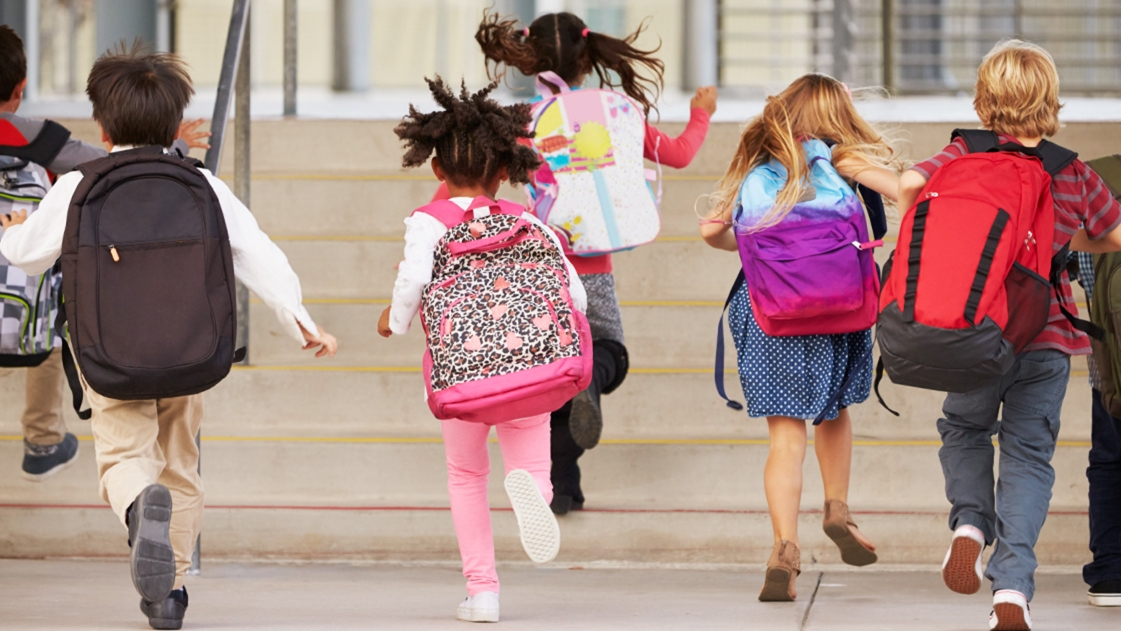 Children entering school building