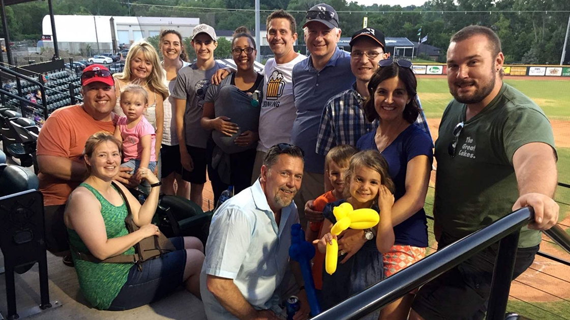 Employees from OHM Advisors gather for a Utica baseball outing.