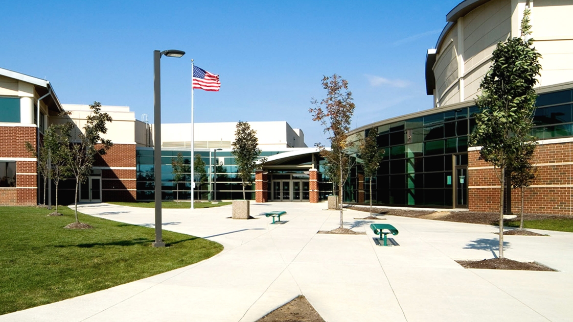 The entrance doors of a secure high school building.