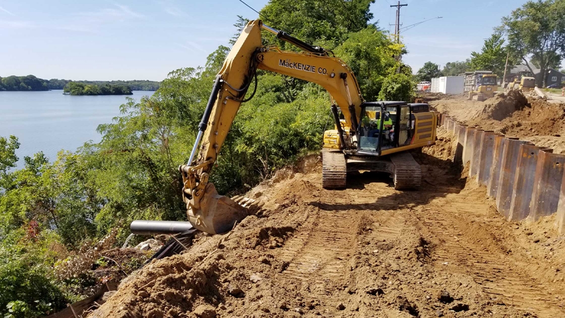 Construction along Grove Road in Ypsilanti Township, repairing slope degradation along Ford Lake.