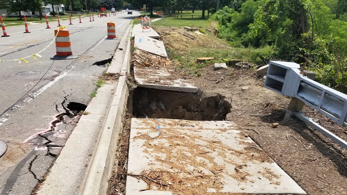 Infrastructure damage along Grove Road in Washtenaw County, requiring emergency stabilization.