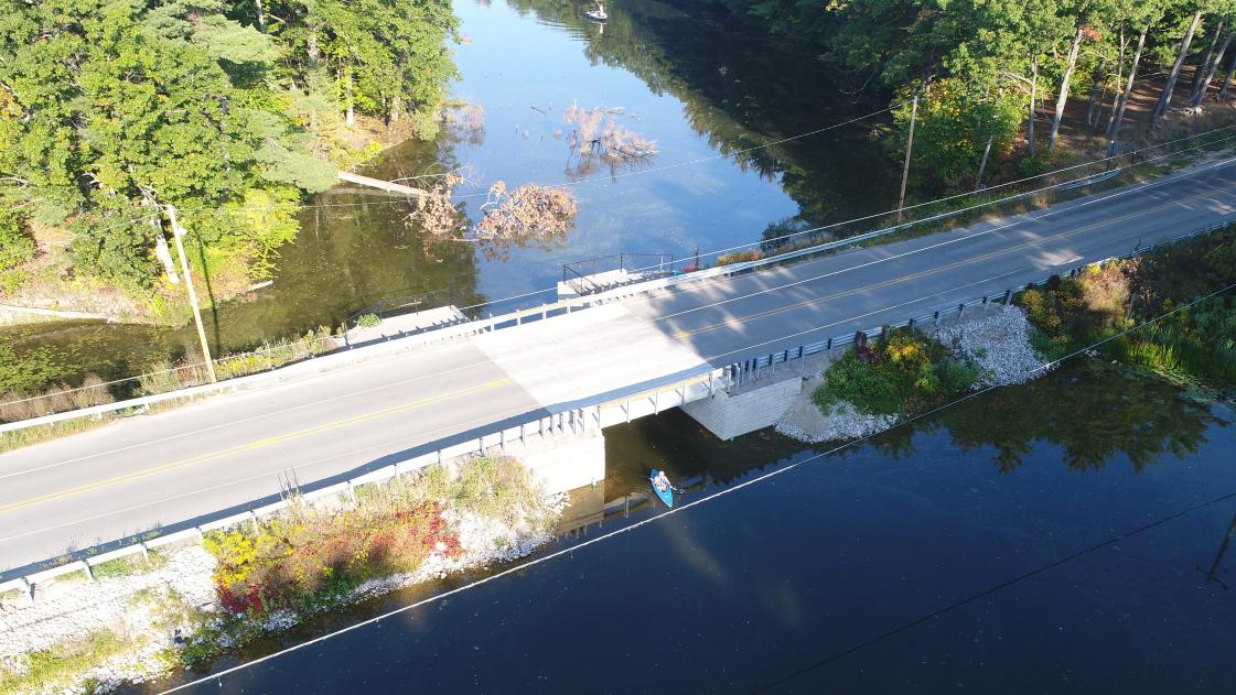 Someone kayaks under an updated Midland County, Michigan bridge.