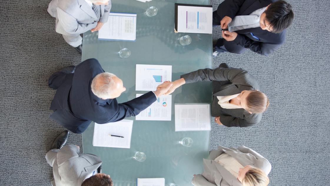Men and women in boardroom