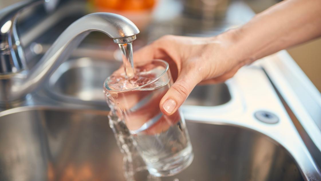 Pouring a glass of drinking water from the tap