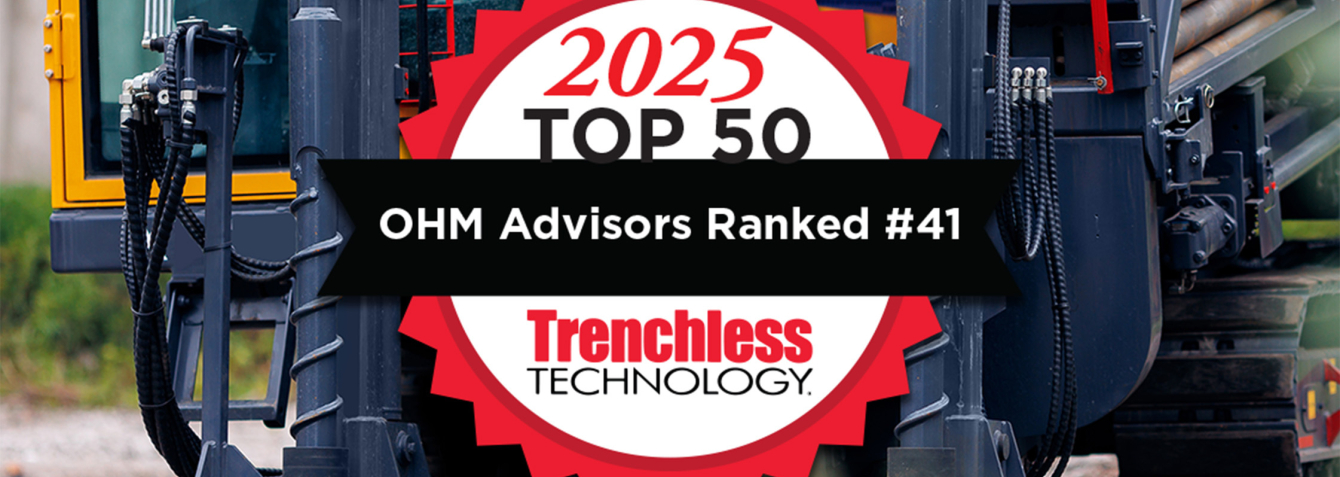 Heavy machinery with logo indicated that OHM Advisors is ranked 41st on Trenchless Technology list of engineering firms for 2025. 