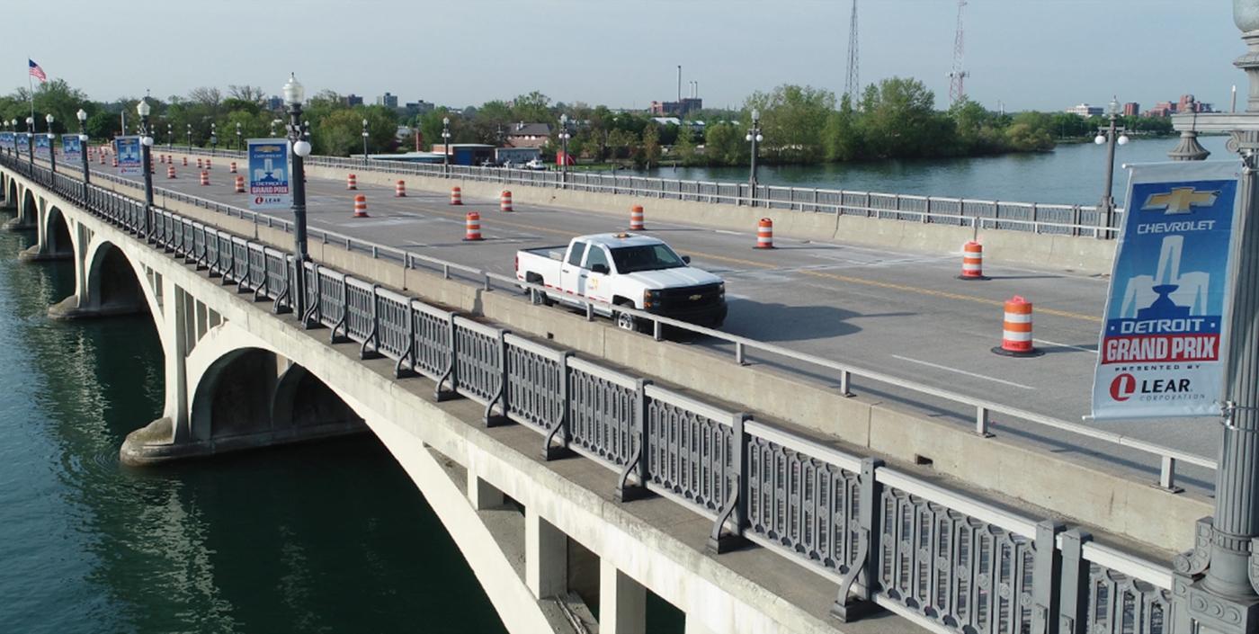 An OHM Advisors truck parked on the Douglas A. MacArthur Bridge during preservation.