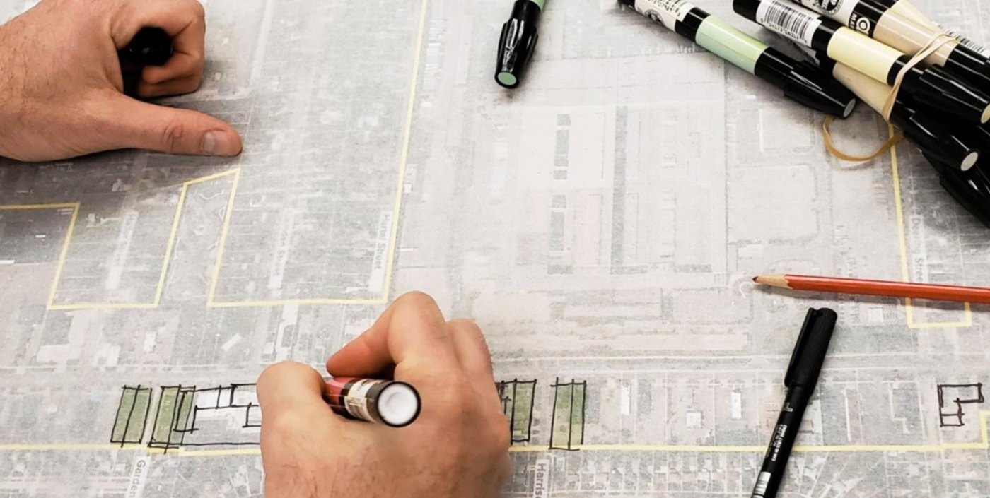 Planners hands drawing Livonia Master Plan