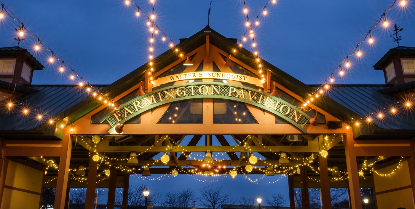 Downtown Farmington's Pavilion lit up at night.