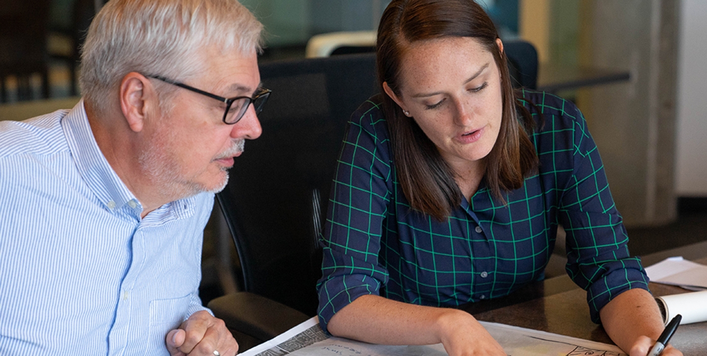 Our planning team members discuss the best approach to a project. 