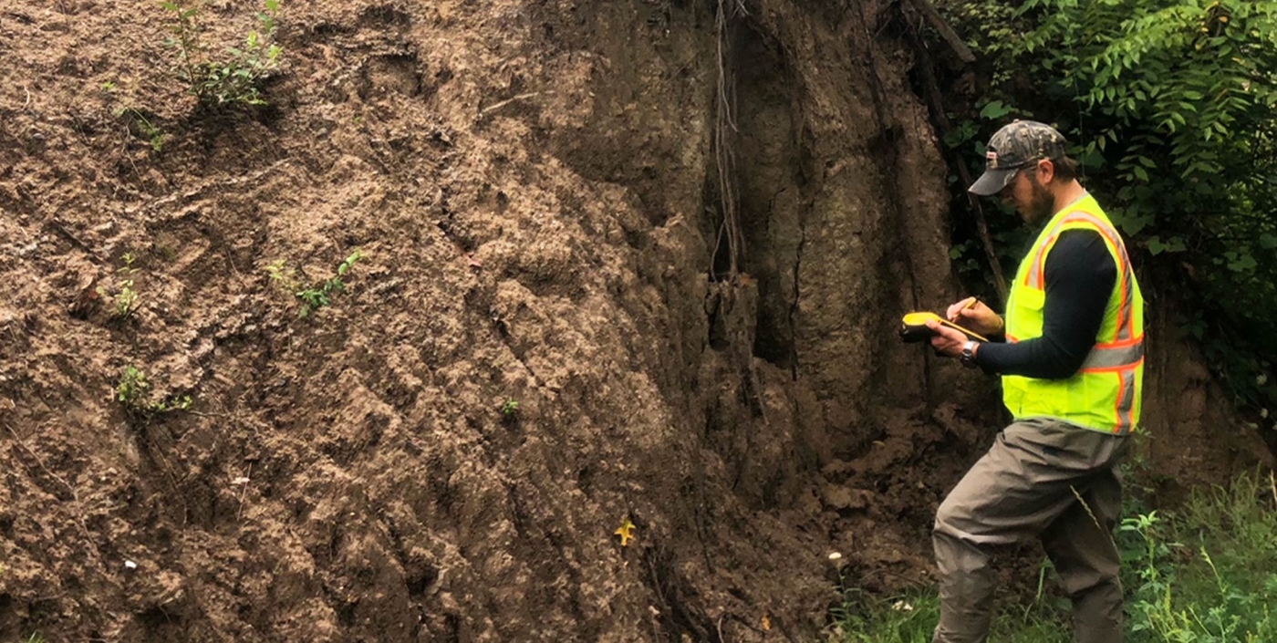 One of our water experts conducts a condition assessment on a trench.
