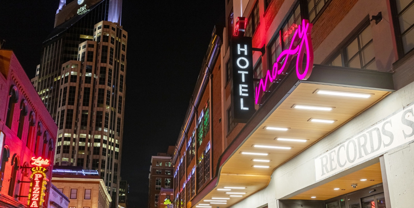 Exterior front shot of the Moxy Hotel at night