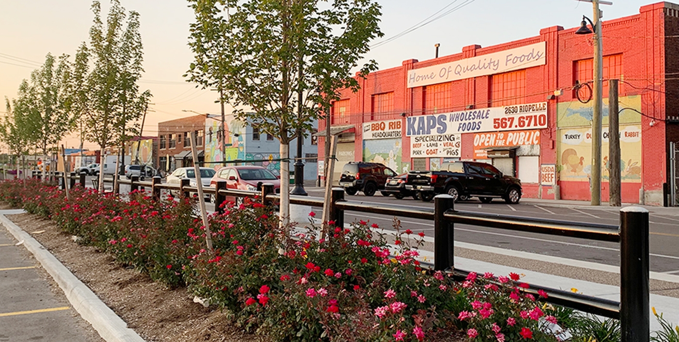 View of storefronts and new streetscaping along Riopelle Street in Detroit, MI