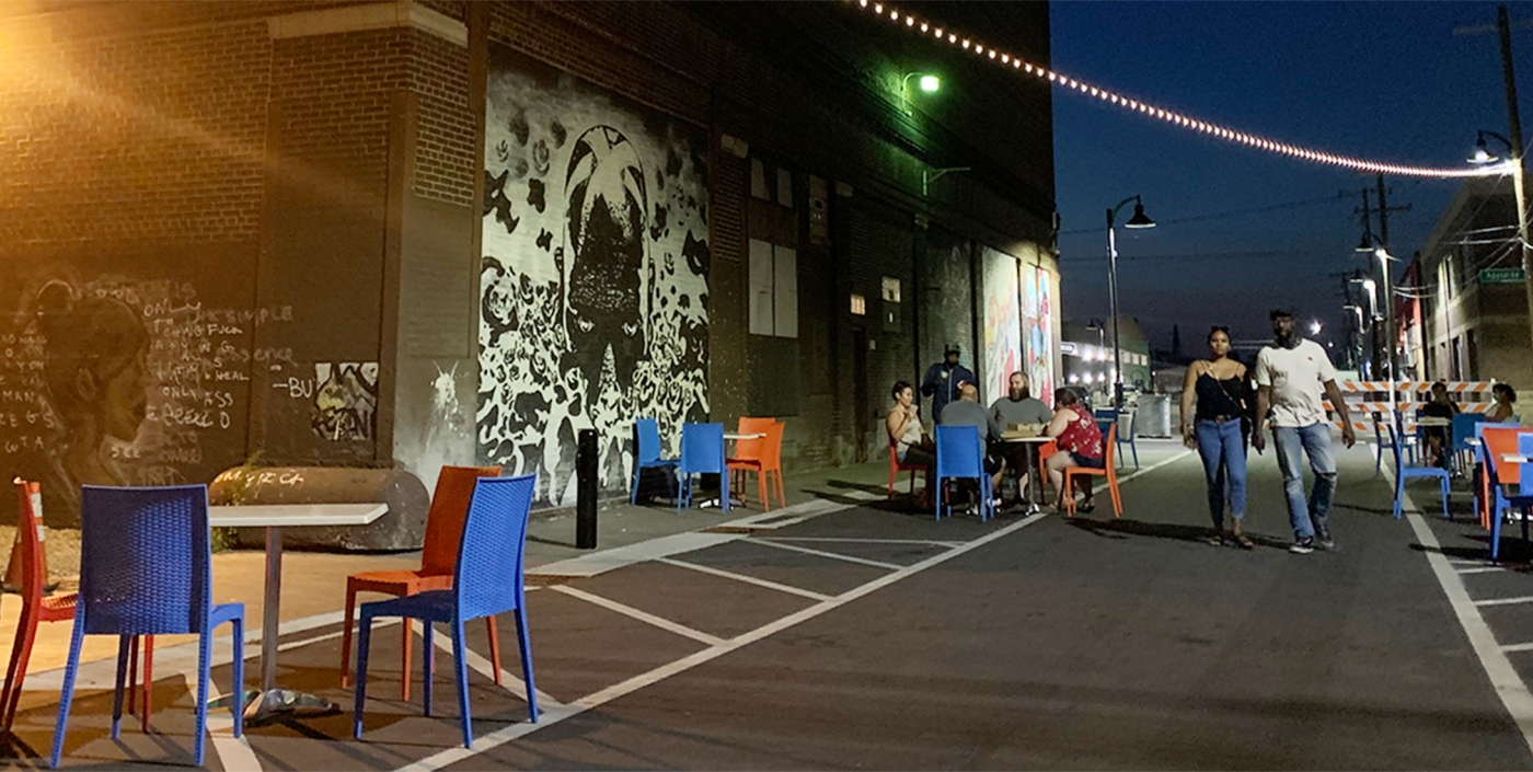 The two southernmost blocks were designed as a one-way “flex” street with flush curbs and sidewalk to allow the street to transform into a pedestrian plaza during social events held by the Eastern Market and local businesses as shown here