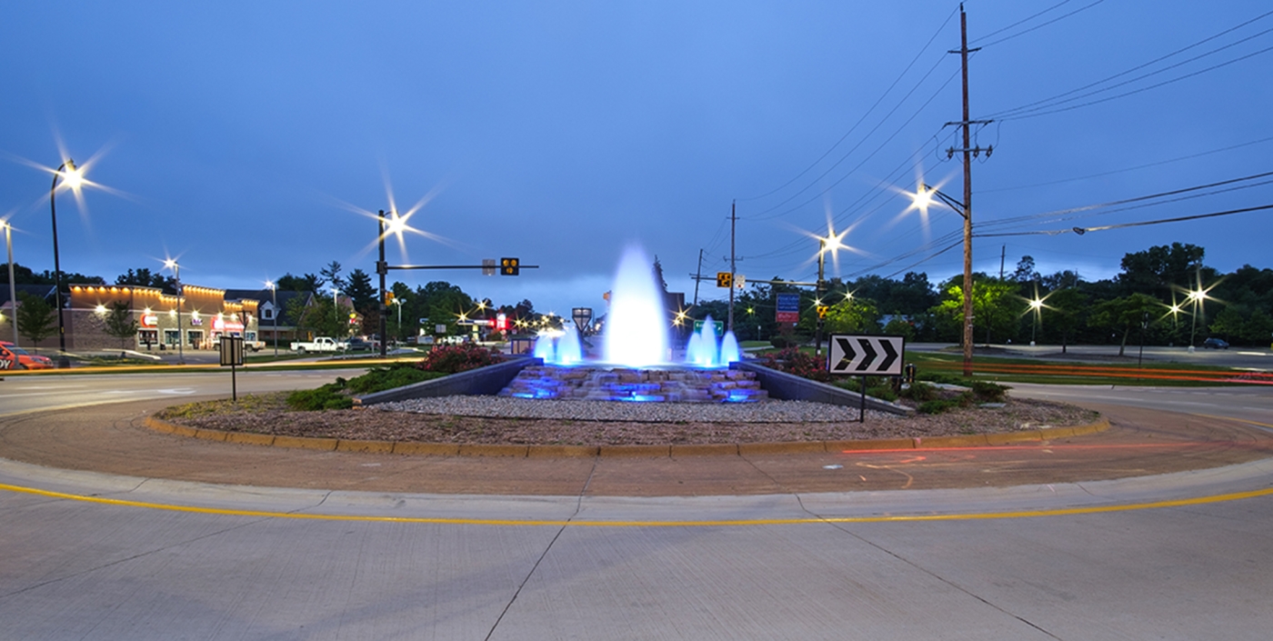 Illuminated Baldwin Road roundabout at night.