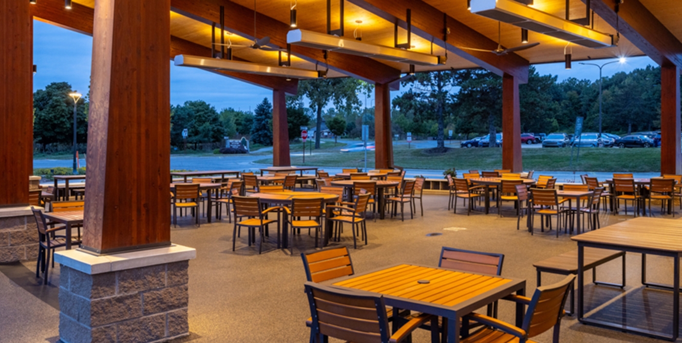 Moveable seating under covered pavilion at Jeanne Stine Park in Troy, Michigan.