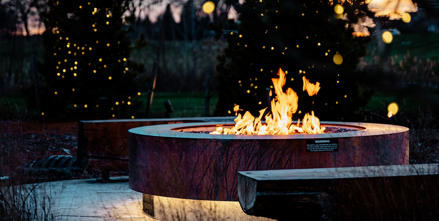 Fire pit seating at Jeanne Stine Park in Troy, Michigan.