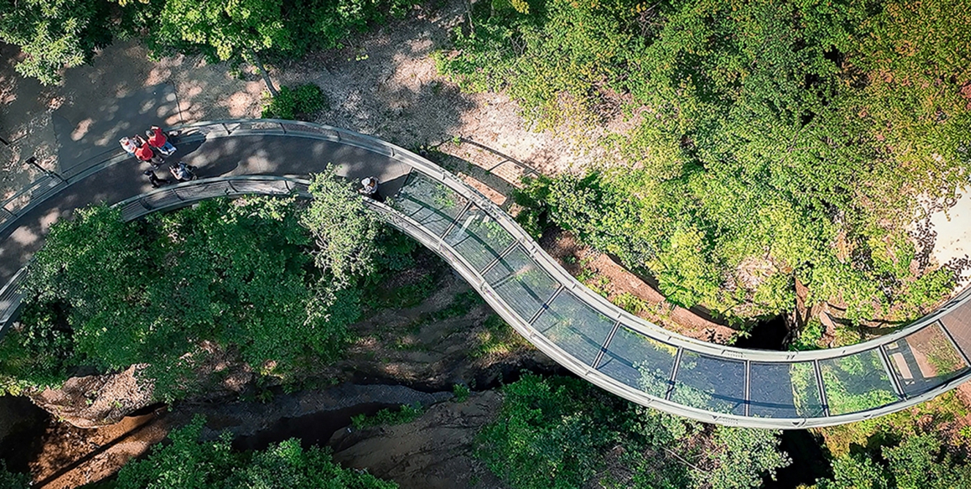Birds-eye view looking down at the winding glass walkway at Nelson-Kennedy Ledges State Park