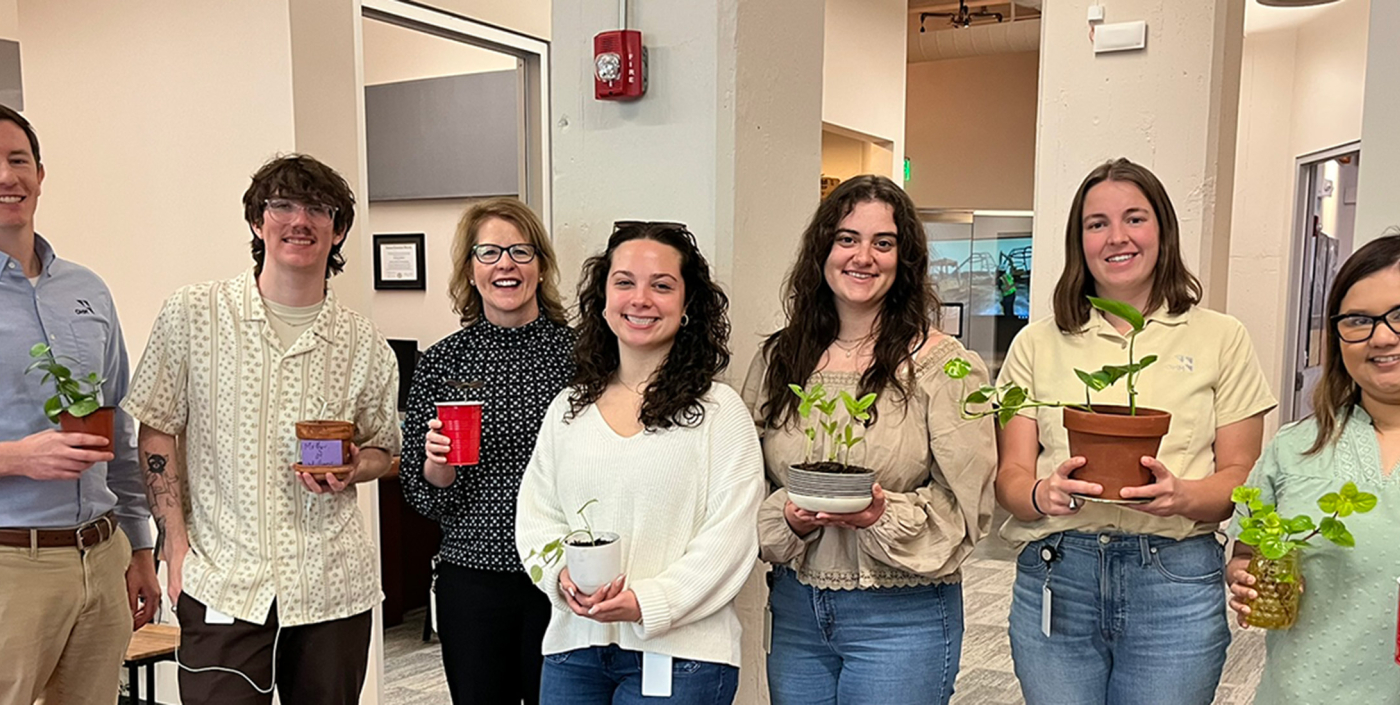 Group of employees celebrating National Plant a Flower Day