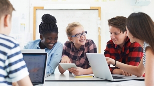 Students using laptops to learn