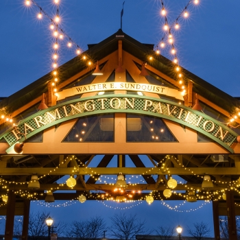 Downtown Farmington's Pavilion lit up at night.