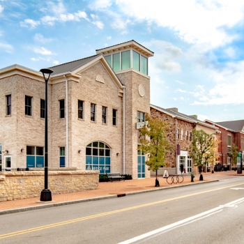 A daytime view of the streetscape along Dublin, Ohio's Bridge Park West mixed-use buildings.