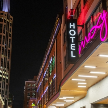 Exterior front shot of the Moxy Hotel at night