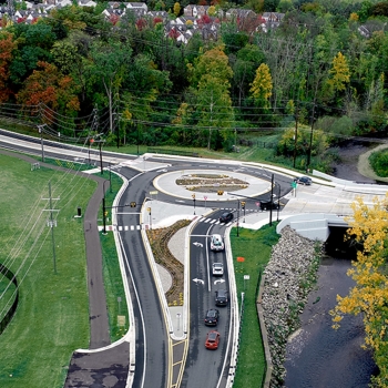 Aerial photo shows of finished roundabout and innovative stormwater management solution.