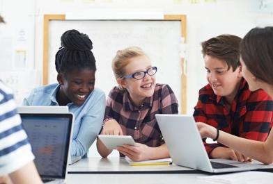 Students using laptops to learn