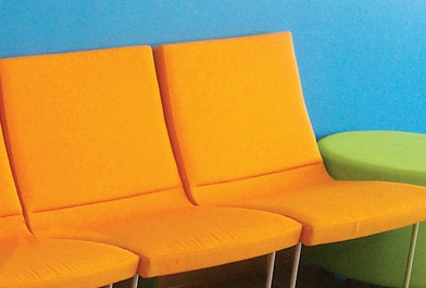 Bright orange chairs in a student-centered learning environment.