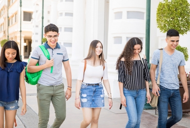 Young adults walk through mixed-use development.