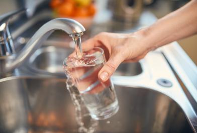 Pouring a glass of drinking water from the tap