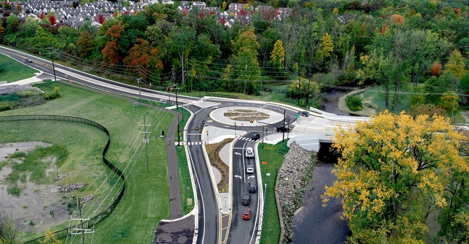 Aerial photo shows of finished roundabout and innovative stormwater management solution.