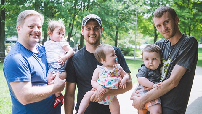 OHM Advisors' team members and their children at employee summer picnic. 